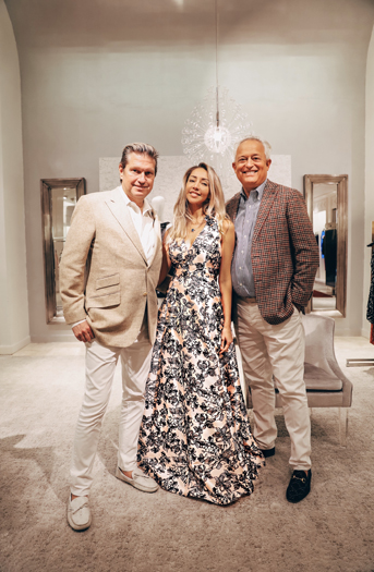 Karen Huggins wearing a Badgley Mischka gown beside Mark Badgley and James Mischka