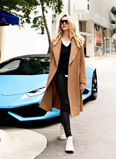 Karen Huggins wearing a camel Ralph Lauren coat in the Miami Design District