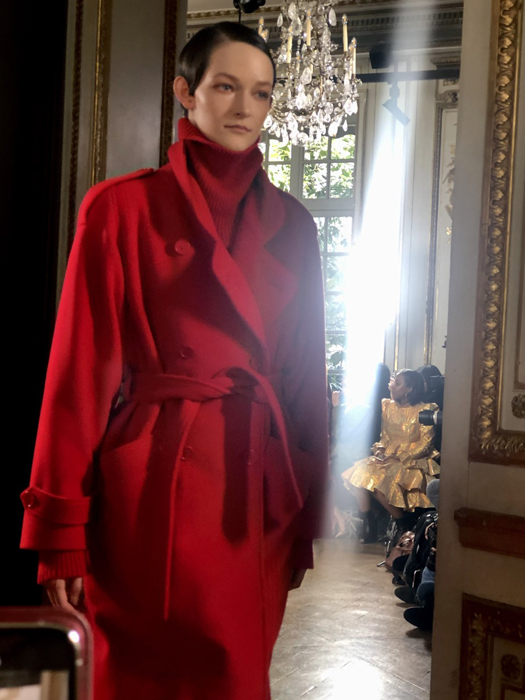 Ryan Roche model in a red coat