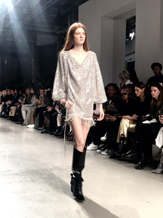 Ingie Paris model in a shimmering short dress and black boots