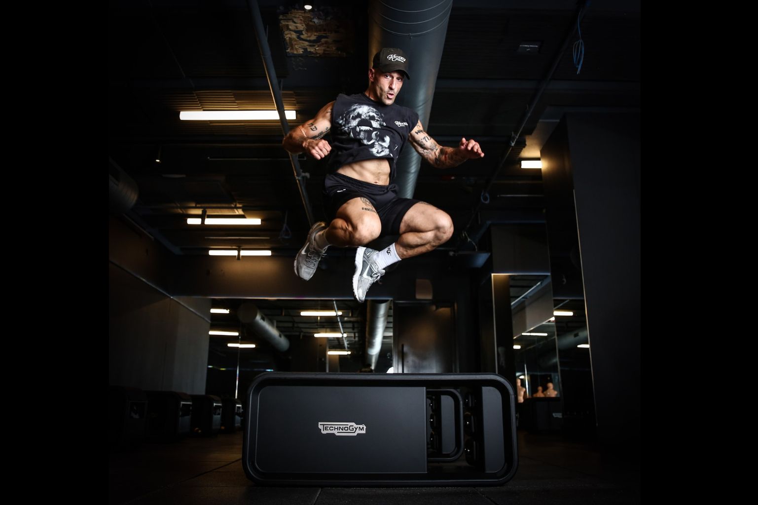 Fitness entrepreneur Noah Neiman performs an explosive plyometric jump during a training session, reflecting the energy and community-driven philosophy behind The Pack.