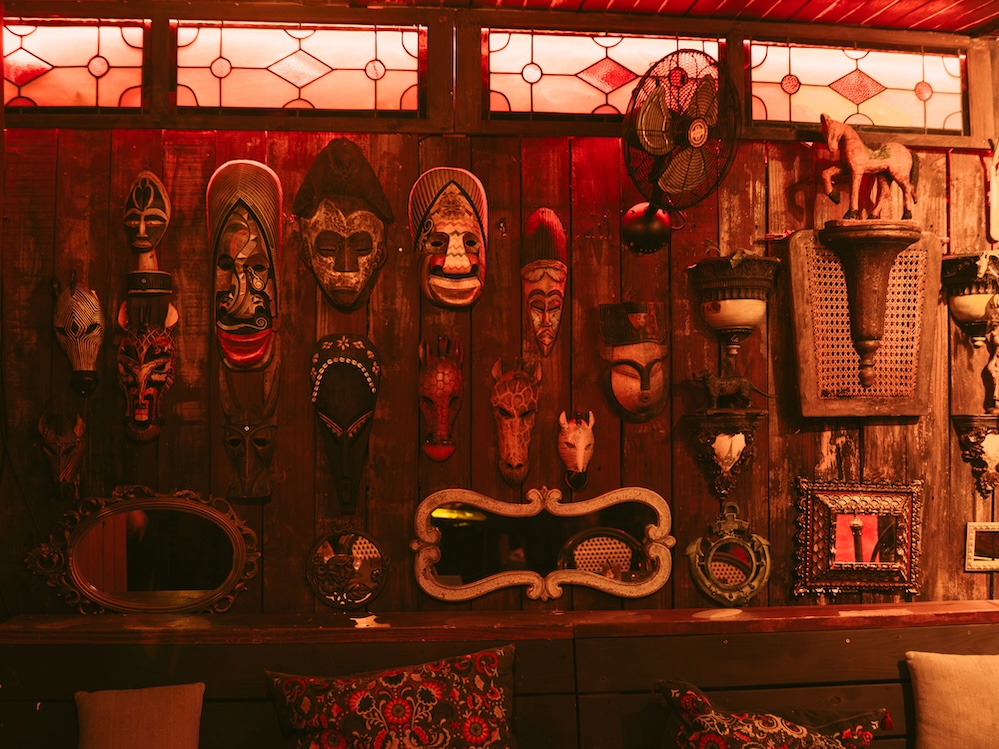 Collection of masks, mirrors and stained glass